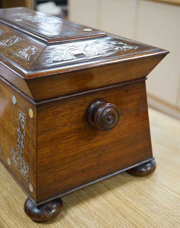 A Victorian rosewood and mother-of-pearl inlaid sarcophagus tea caddy, 39cm wide. Condition - fair